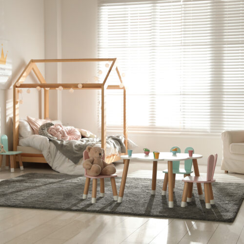 small,table,and,chairs,with,bunny,ears,in,children's,bedroom